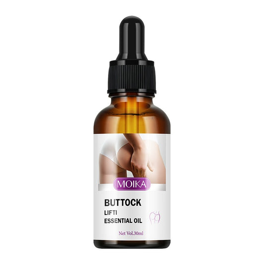 An amber glass dropper bottle of MOIKA Buttock Lift Essential Oil with a black dropper cap and a white label featuring a photo of a buttock.